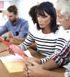 Two business professionals having a discussion in a meeting